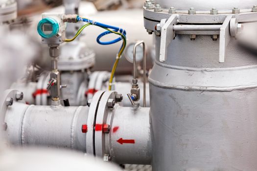 detail of oil pipeline with valves in large oil refinery