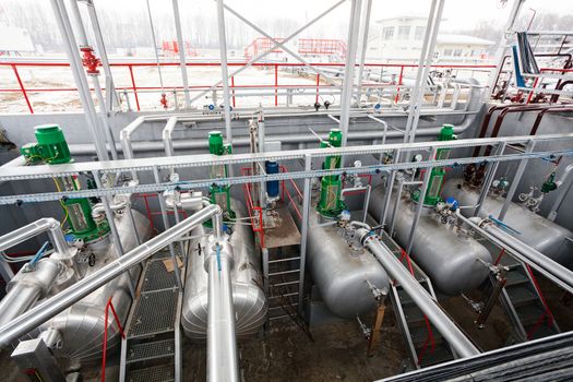 detail of oil pipeline with valves in large oil refinery