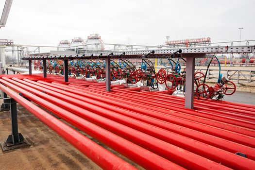 detail of oil pipeline with valves in large oil refinery