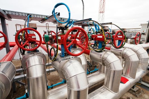 detail of oil pipeline with valves in large oil refinery