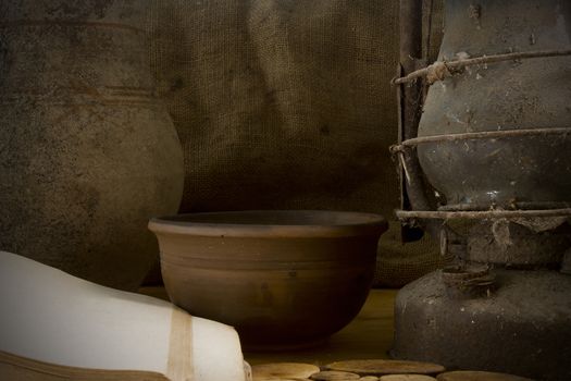 Vintage still life with pottery on the background of sacking