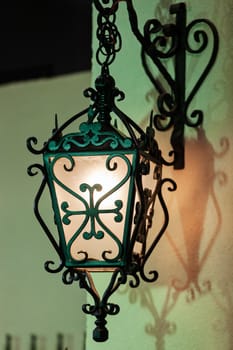 details of structure and ornaments of wrought lamp