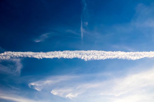 Beautiful sunny blue sky and chemtrail in spring.