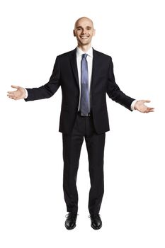 Cheerful businessman greets his guests. Portrait of man in suit isolated on white background.