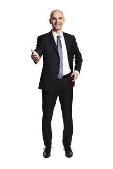 Smiling man greets his guests. Portrait of man in suit isolated on white background.