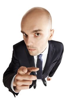 Above view of young businessman points his finger at you. Copy space. Isolated on white background.