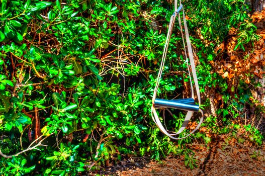 Closeup on homemade suspension training kit in a garden