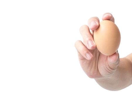 Man hand holding egg on white background
