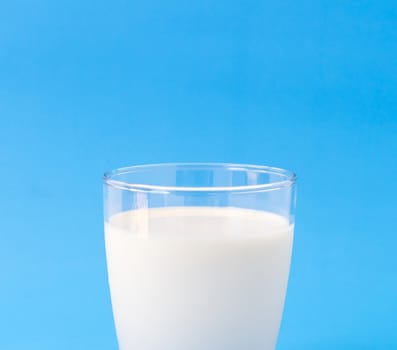 Closeup glass of milk on blue background, food and drink for healthy concept