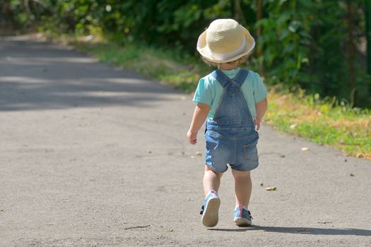 Little girl alone on street in summer