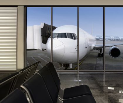 window in empty airport at morning, plane expects tourists at airport