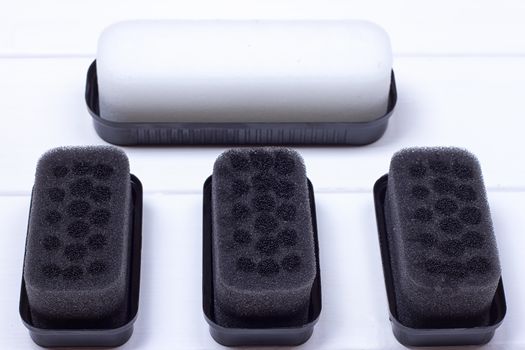 Black sponge for care of footwear on the white