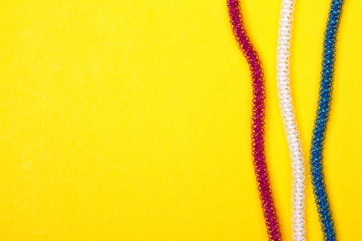 blue pink white rope on a yellow background