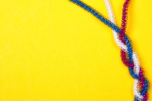 blue pink white rope on a yellow background