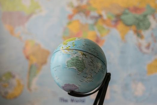 Australia map on a globe with the whole world as background