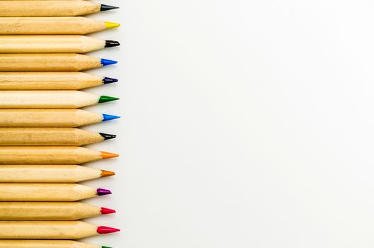 Colorful pencils on the white background