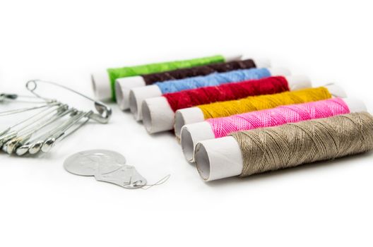 sewing tools and pins on the white background