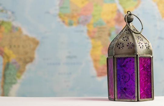 a colourful traditional lantern on a world map background
