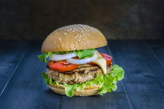 Closeup of home made burgers on wooden background