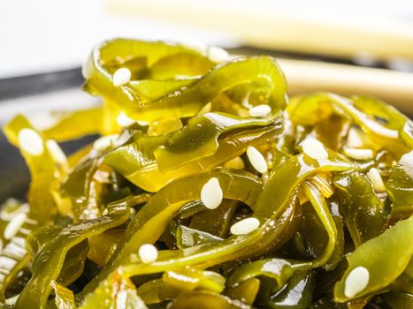 Extreme close up view of kelp seaweed salad with sesame seeds