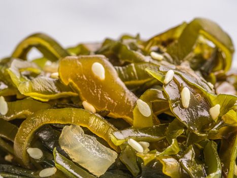 Extreme close up view of kelp seaweed salad with sesame seeds