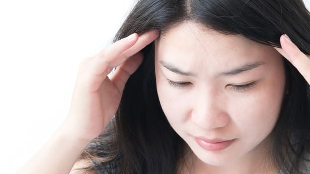 Closeup asian woman having headache with whitebackground