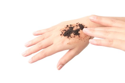 Woman's hand with scrub coffee grounds on skin hand and arm, beauty and healthy care concept