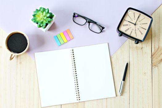 Still life, business, office supplies or education concept : Top view or flat lay of open notebook paper with blank pages, accessories and coffee cup on wooden background, ready for adding or mock up