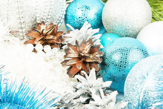 New year silver and blue decorations on white background close up