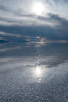 Sunset in Salar de Uyuni salt flats desert, Andes Altiplano, Bolivia