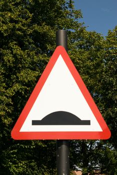 Bump warning traffic sign in a park in GB