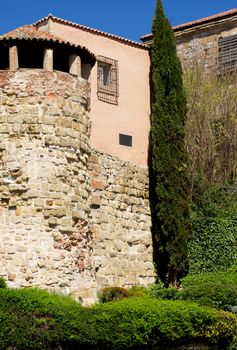Obsolete House with Tower, Gallery and Surrounded Wall with Plants Outdoors. Salamanca, Spain