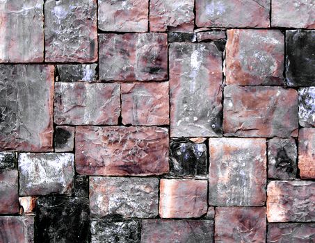 Background of Grey, Black and Red Cobblestones with Sharp Spears closeup Outdoors