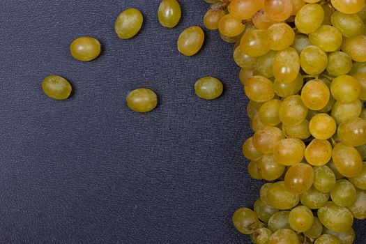 White grapes on a black background. copy-cpace