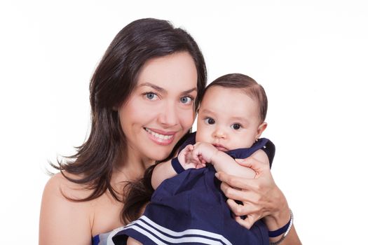 Mother and her baby girl looking at the camera