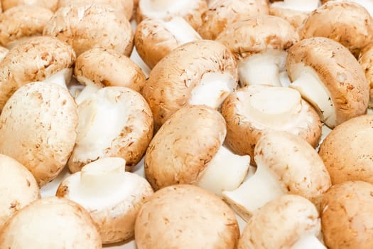 Background of the fresh whole uncooked button mushrooms closeup
