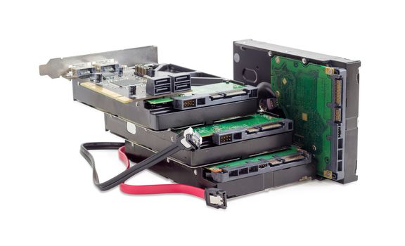 Several SATA hard disk drives, disk array controller card and interface cables on a white background
