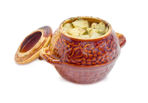 Dish Chanakhi - potatoes with meat, mushrooms and haricot beans roasted in a clay pot with cover on a white background
