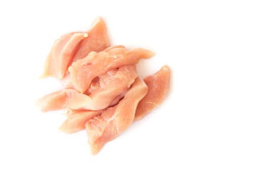 Raw cut chicken filled on white background