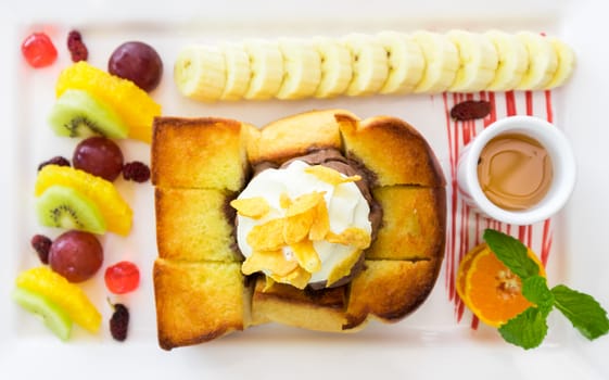 Closeup top view Honey Toast on white plate, selective focus