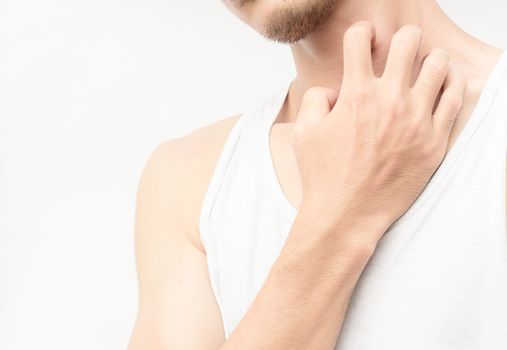 Closeup young man scratch the itch on neck with white background