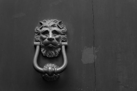 Close up of rustic old door in Florence, Italy.