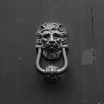 Close up of rustic old door in Florence, Italy.