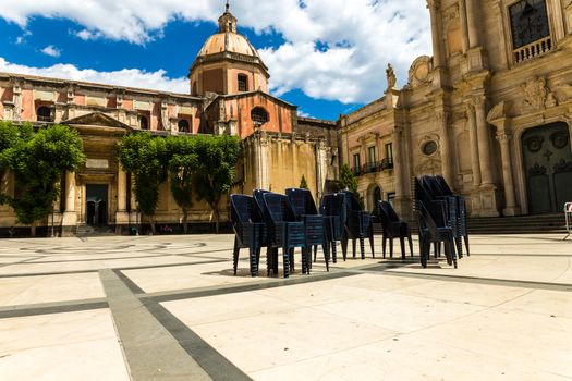 Sicily (Italy), some chairs in the square in a day of summer
