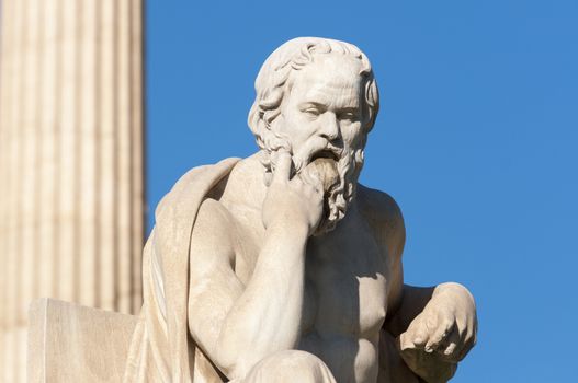 classical statue of Socrates in front of a column