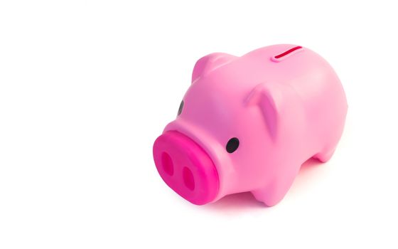 Cute pink piggy bank isolated on white background
