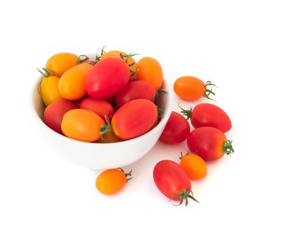 Fresh cherry tomatoes in bowl on white background