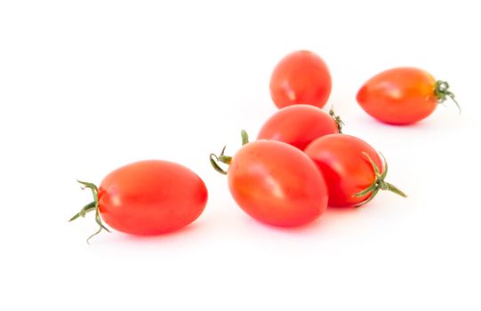 Fresh cherry tomatoes on white background