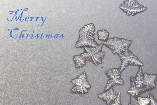 merry christmas concept. words written on frozen window