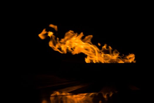 fire background blur in orange color.black background